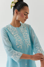 Blue silk chanderi short A-line kurta set highlighted with off white thread embroidery.