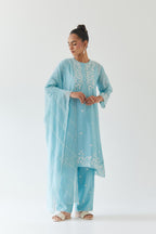 Blue silk chanderi short A-line kurta set highlighted with off white thread embroidery.
