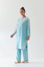 Blue silk chanderi straight short kurta set with off white thread embroidery.