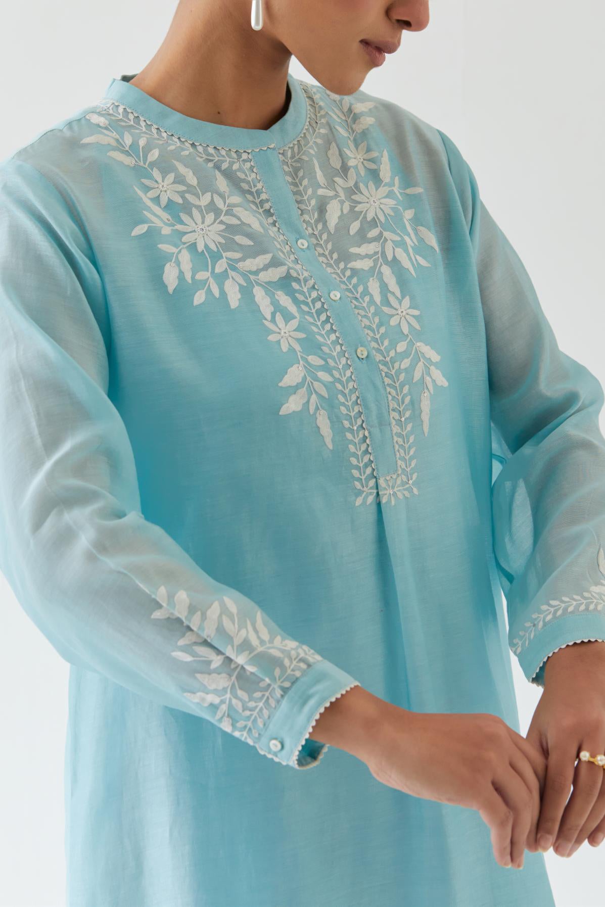 Blue silk chanderi straight short kurta set with off white thread embroidery.