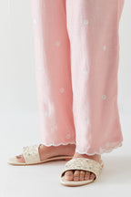 Pink silk chanderi straight pants with off white thread embroidery and scalloped edges at hem.