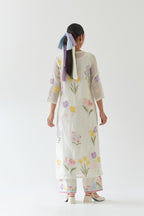 Off white cotton straight kurta set with all-over multi colored applique, highlighted with bead & sequins work.