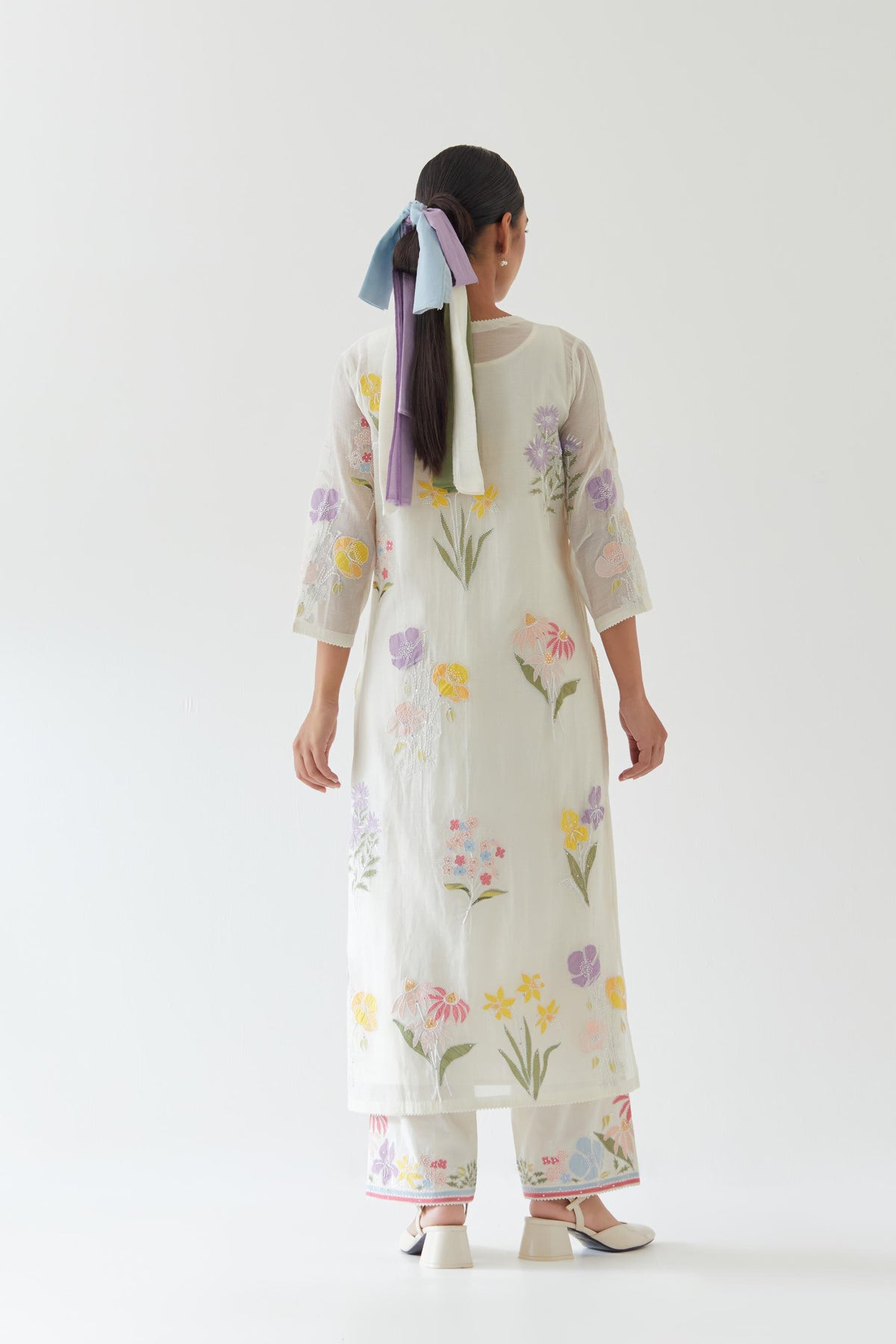 Off white cotton straight kurta set with all-over multi colored applique, highlighted with bead & sequins work.