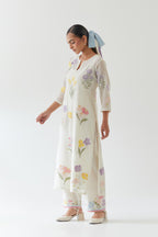 Off white cotton straight kurta set with all-over multi colored applique, highlighted with bead & sequins work.