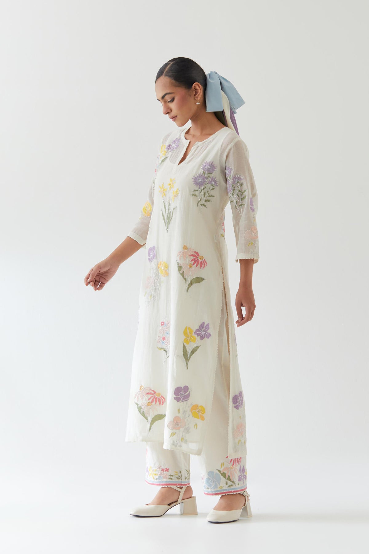 Off white cotton straight kurta set with all-over multi colored applique, highlighted with bead & sequins work.