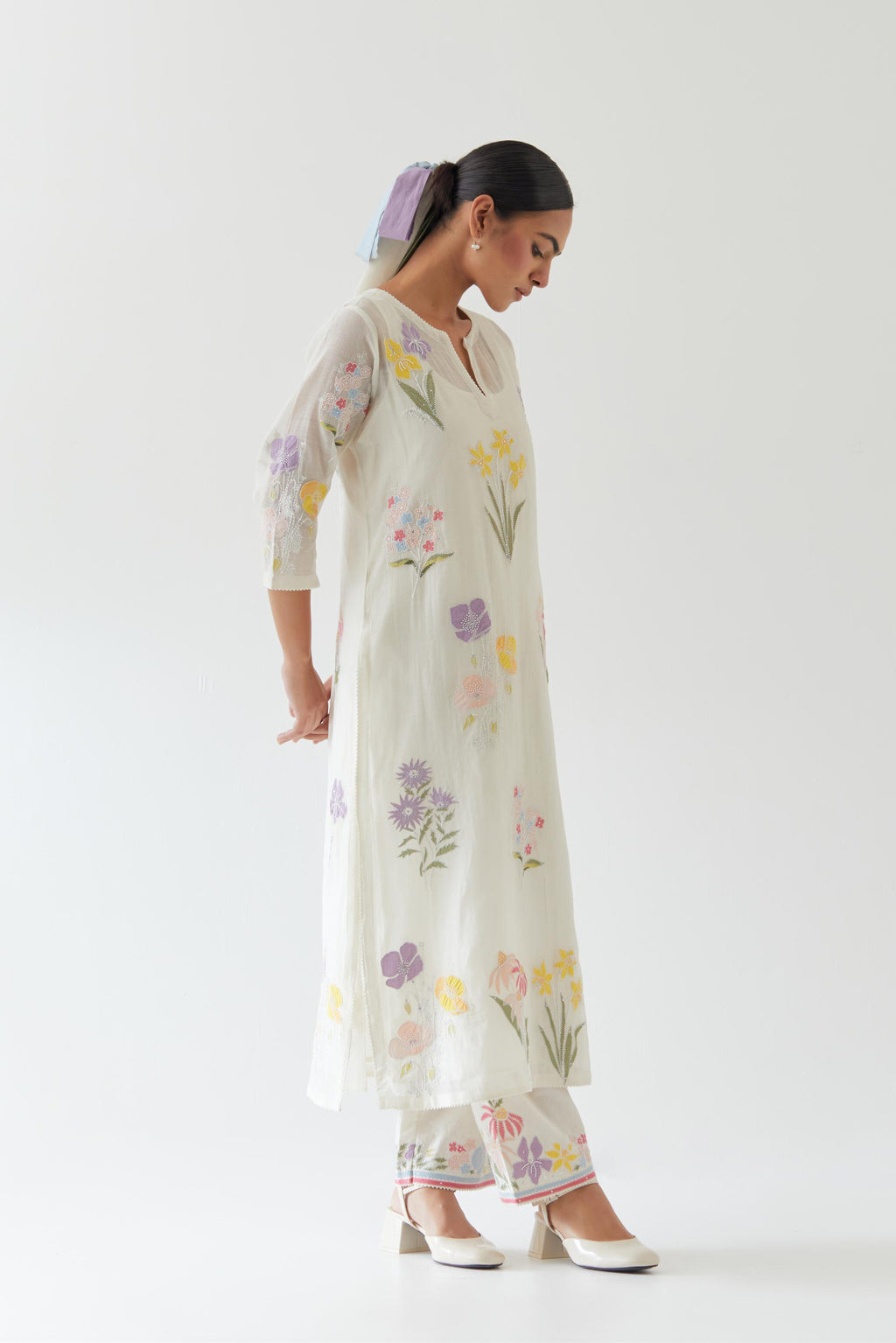 Off white cotton straight kurta set with all-over multi colored applique, highlighted with bead & sequins work.