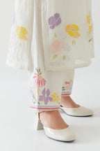 Off white cotton straight kurta set with all-over multi colored applique, highlighted with bead & sequins work.
