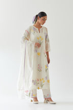 Off white cotton straight kurta set with all-over multi colored applique, highlighted with bead & sequins work.