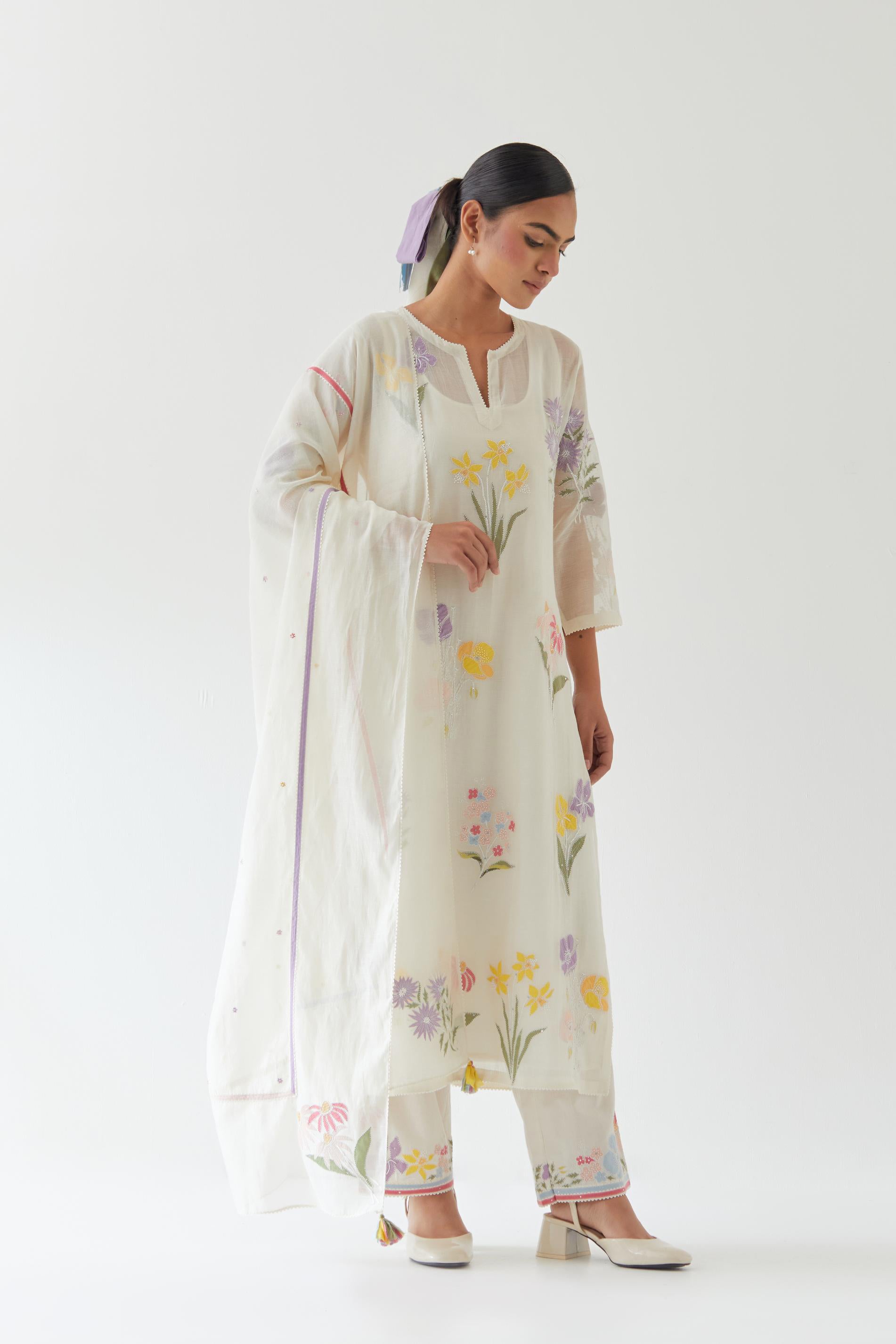 Off white cotton straight kurta set with all-over multi colored applique, highlighted with bead & sequins work.