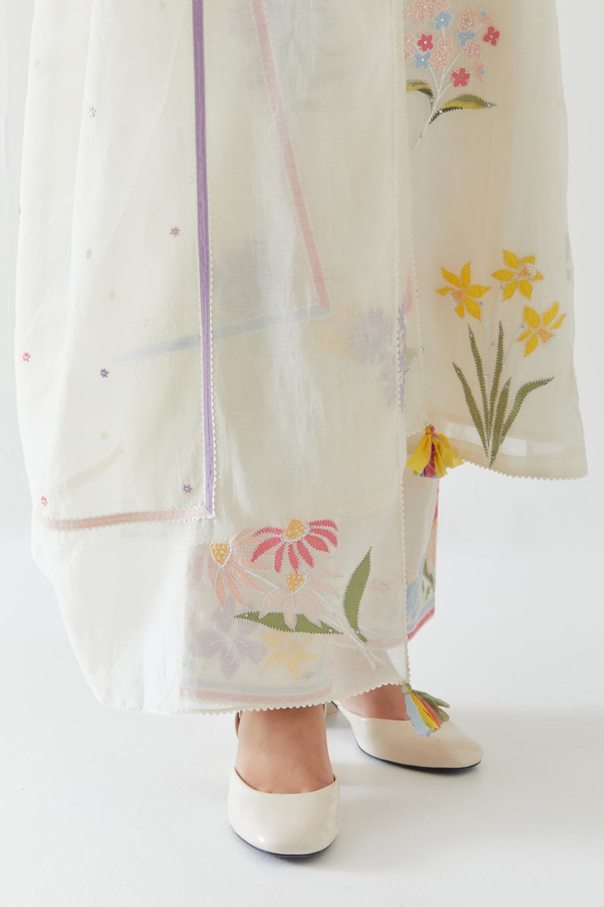 Off white cotton chanderi dupatta with multi colored applique, highlighted with bead & sequins work.