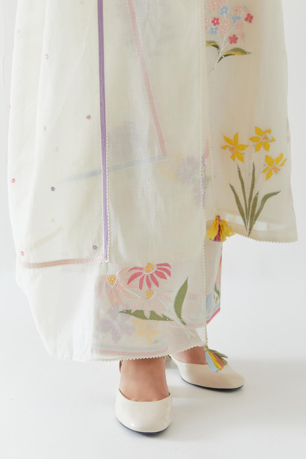 Off white cotton straight kurta set with all-over multi colored applique, highlighted with bead & sequins work.