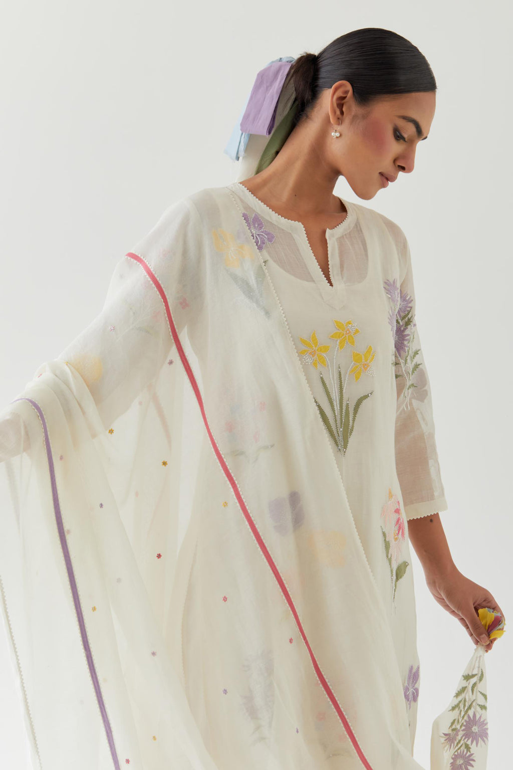 Off white cotton chanderi dupatta with multi colored applique, highlighted with bead & sequins work.
