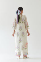 Off white cotton straight side paneled kurta set with all-over multi colored applique, highlighted with bead & sequins work.