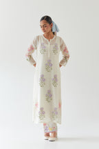Off white cotton straight side paneled kurta set with all-over multi colored applique, highlighted with bead & sequins work.