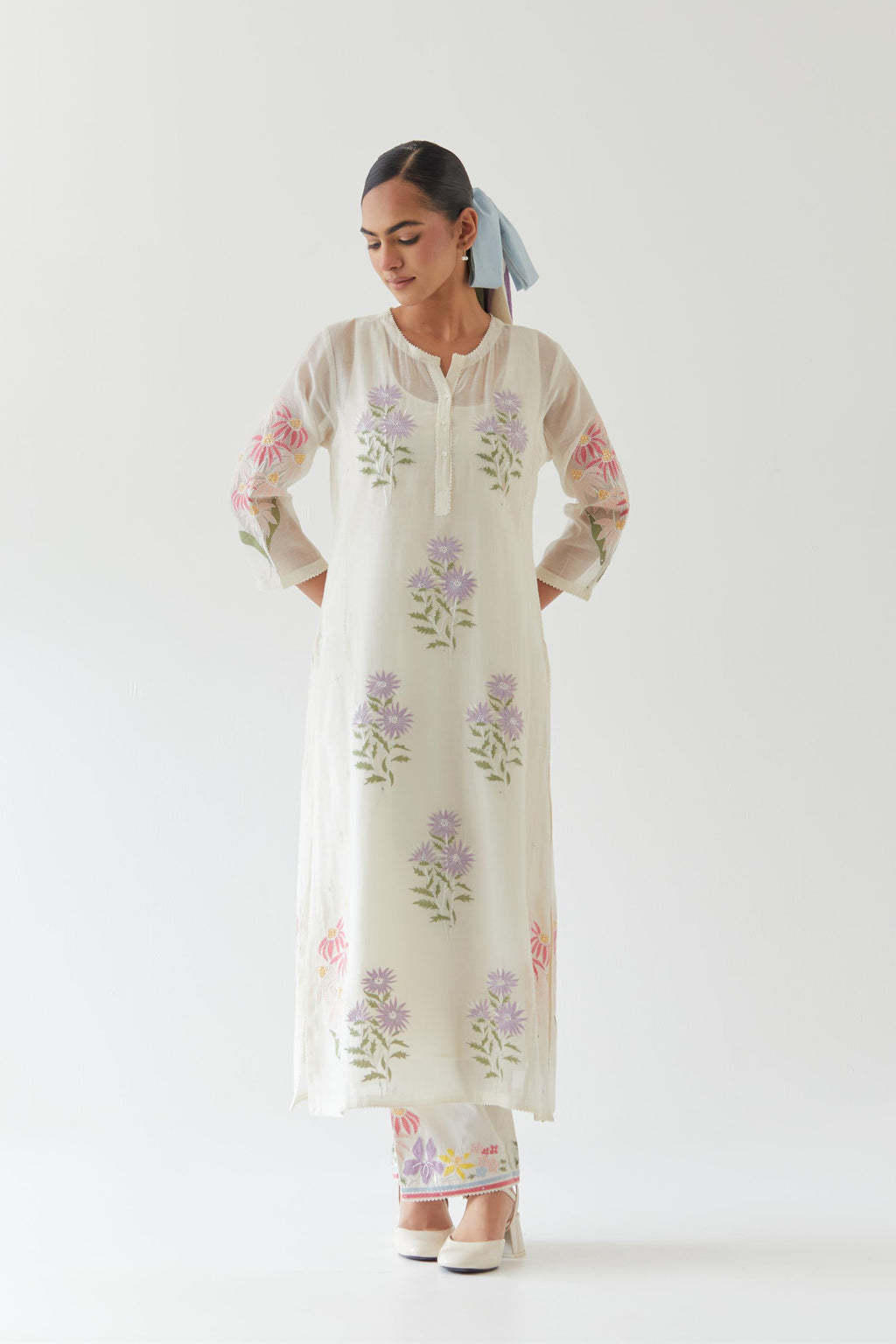 Off white cotton straight side paneled kurta set with all-over multi colored applique, highlighted with bead & sequins work.