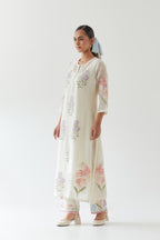 Off white cotton straight side paneled kurta set with all-over multi colored applique, highlighted with bead & sequins work.