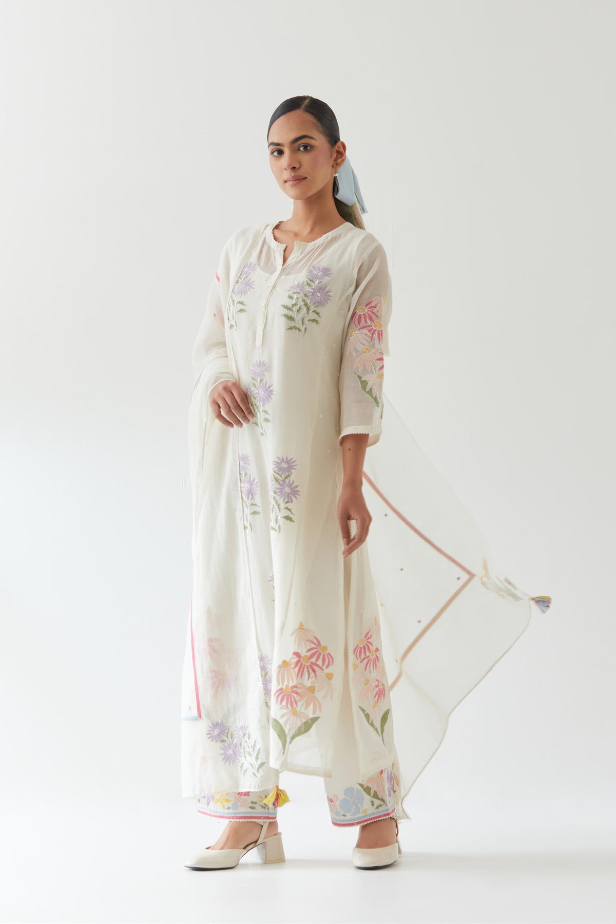 Off white cotton straight side paneled kurta set with all-over multi colored applique, highlighted with bead & sequins work.