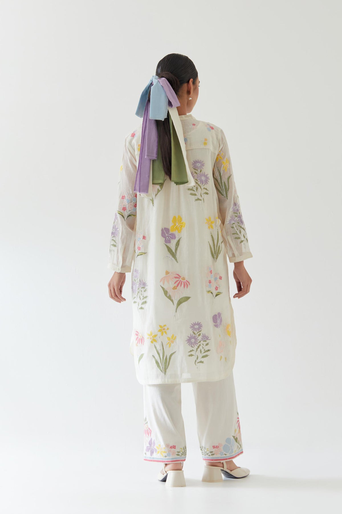 Off white cotton chanderi straight short easy fit kurta set with all-over multi colored assorted flower applique, highlighted with bead & sequins work.
