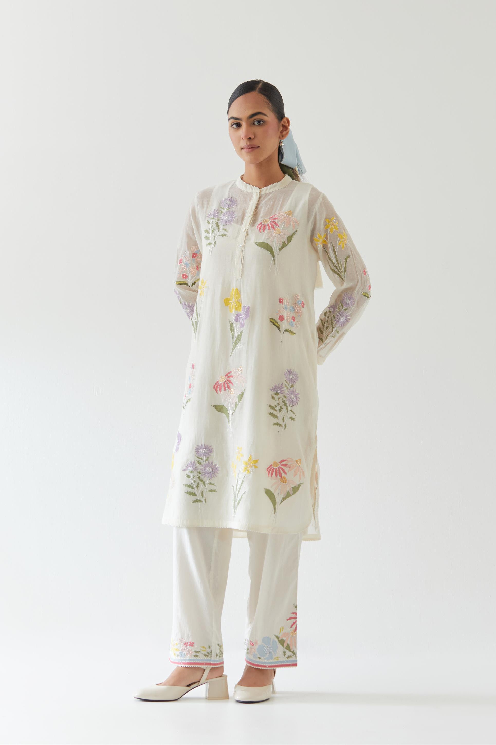 Off white cotton chanderi straight short easy fit kurta set with all-over multi colored assorted flower applique, highlighted with bead & sequins work.