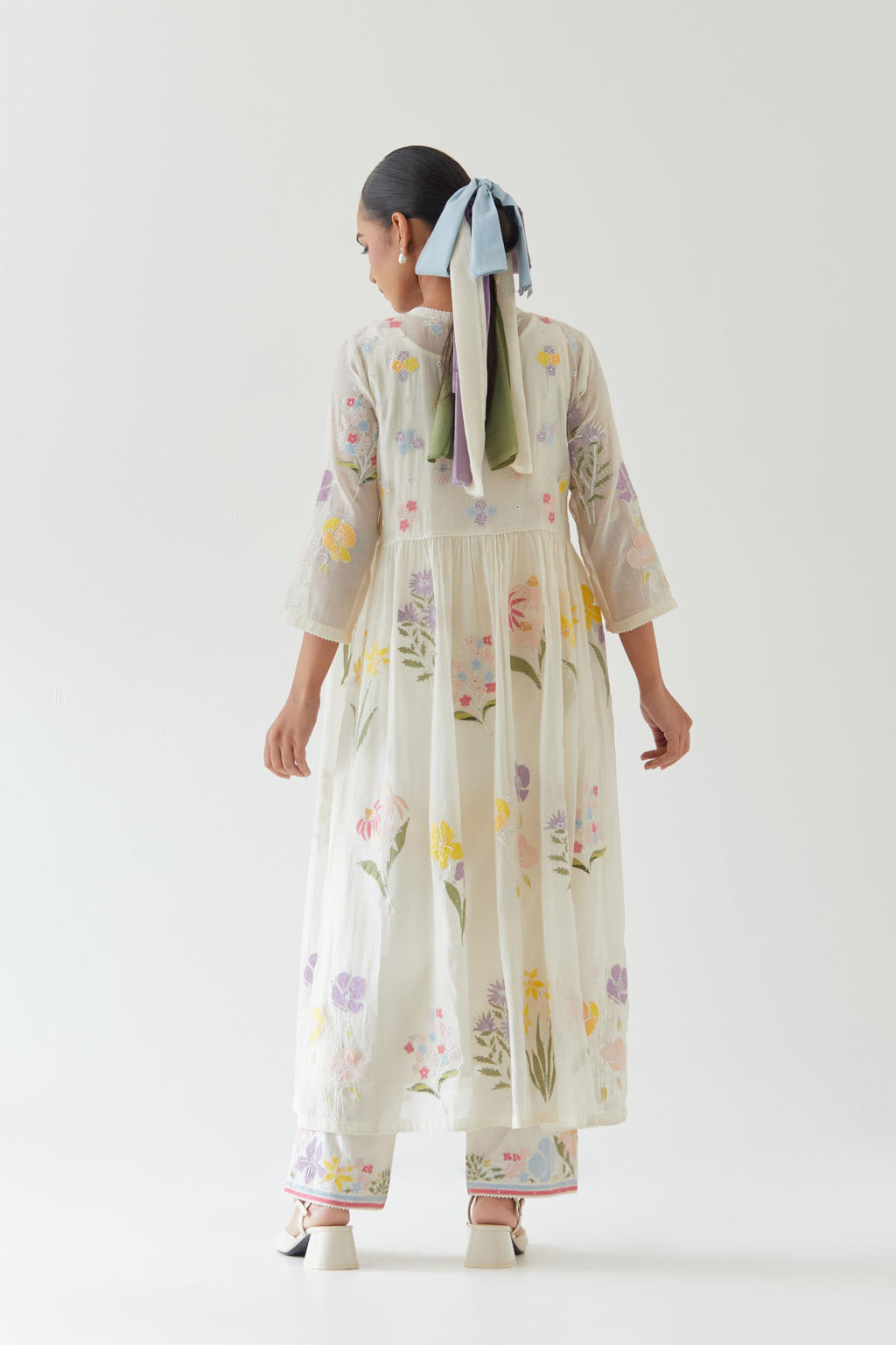 Off white cotton chanderi Kurta set dress with all-over multi colored assorted flower applique, highlighted with bead and sequins.