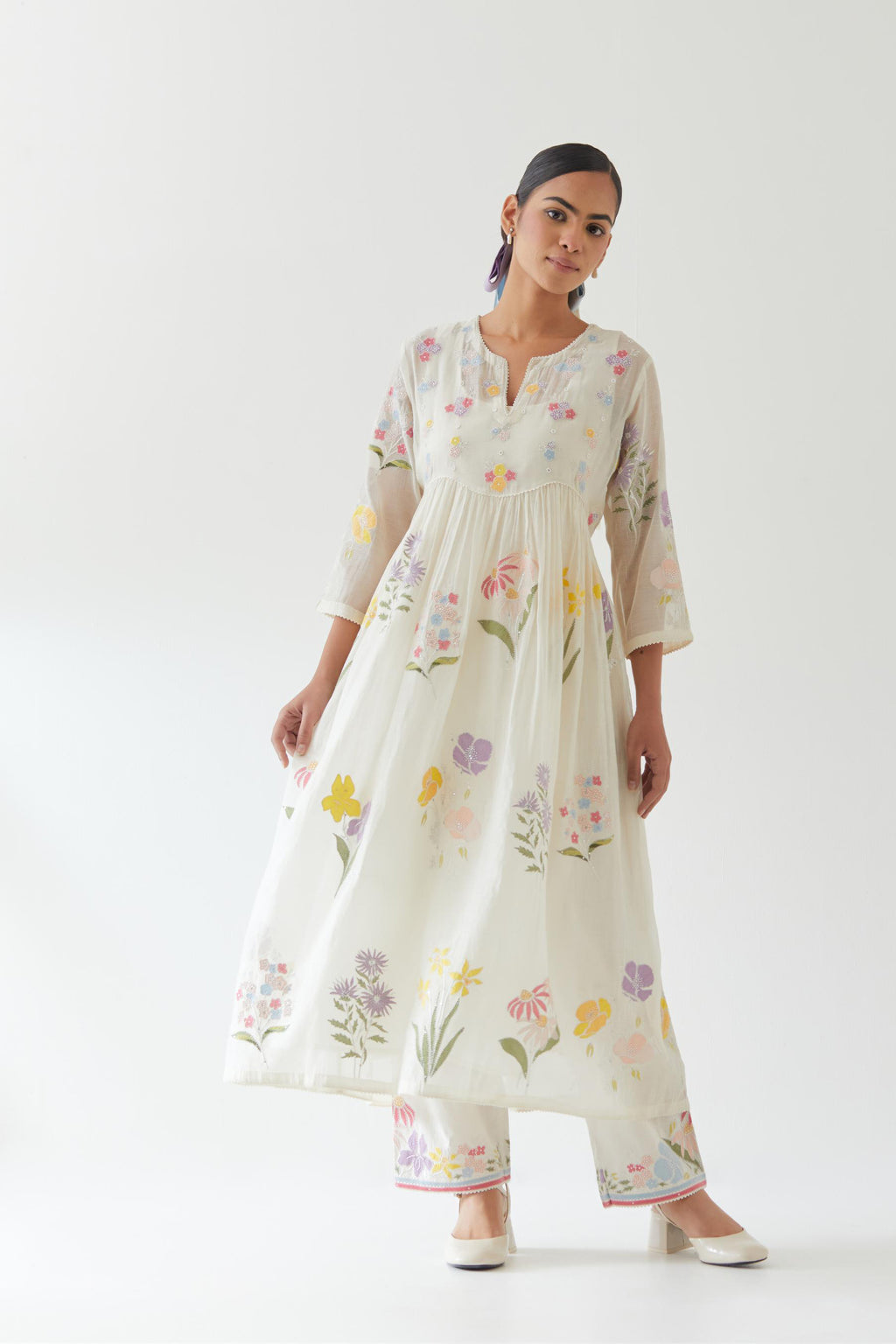 Off white cotton chanderi Kurta set dress with all-over multi colored assorted flower applique, highlighted with bead and sequins.