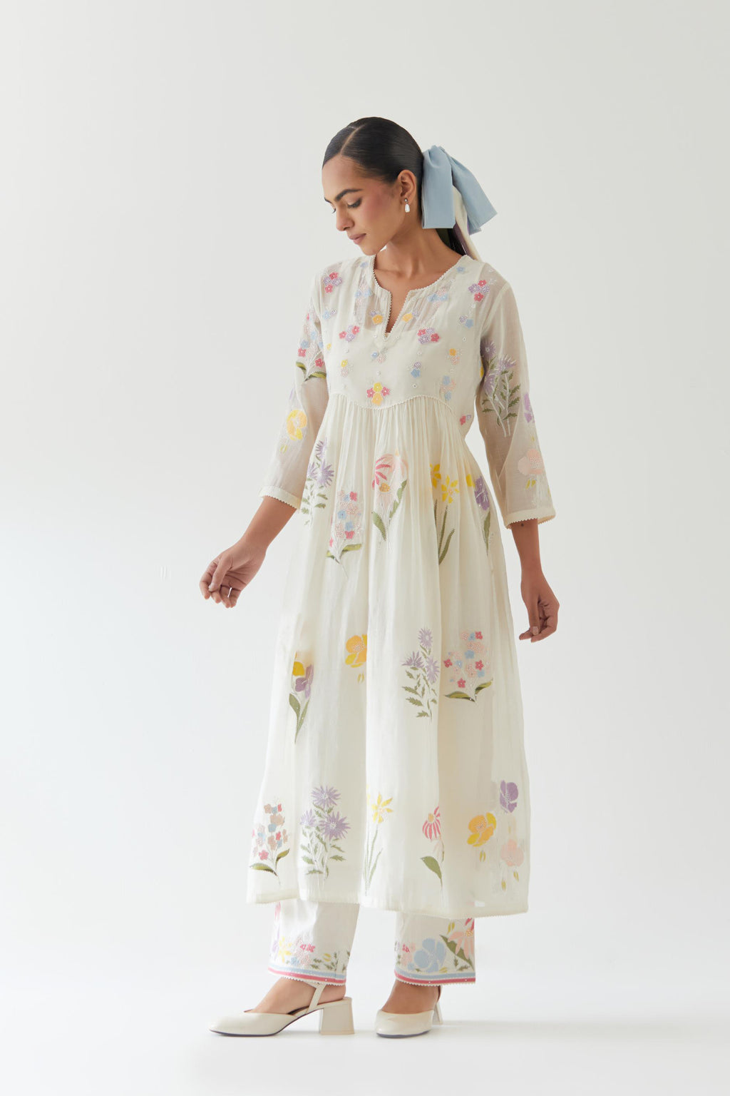 Off white cotton chanderi Kurta set dress with all-over multi colored assorted flower applique, highlighted with bead and sequins.