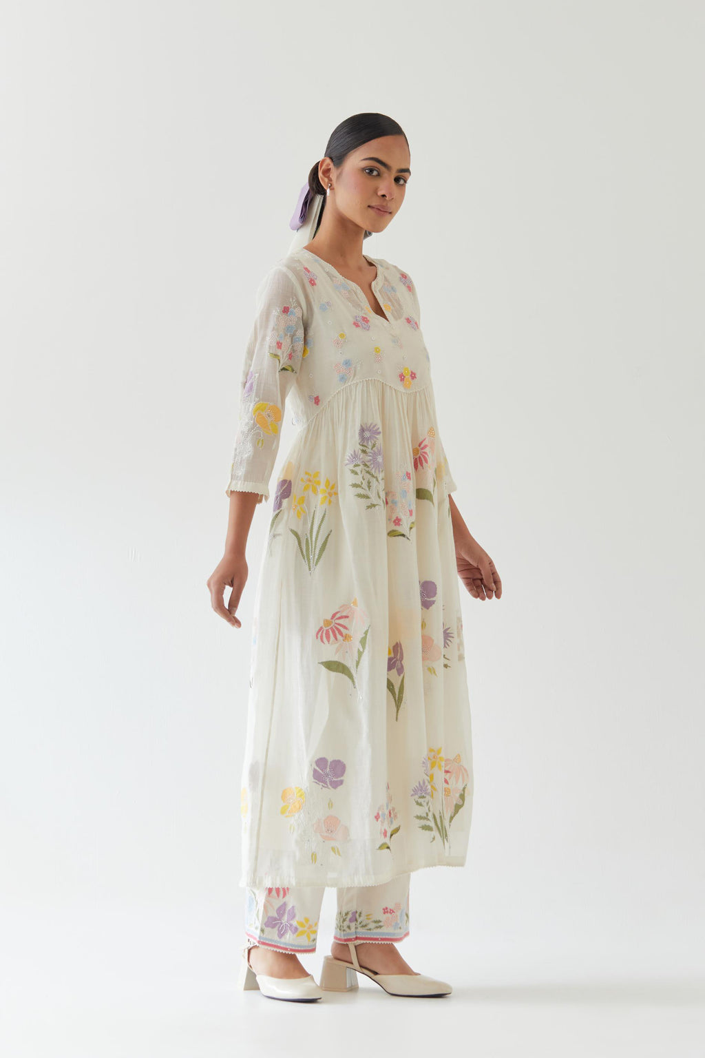 Off white cotton chanderi Kurta set dress with all-over multi colored assorted flower applique, highlighted with bead and sequins.