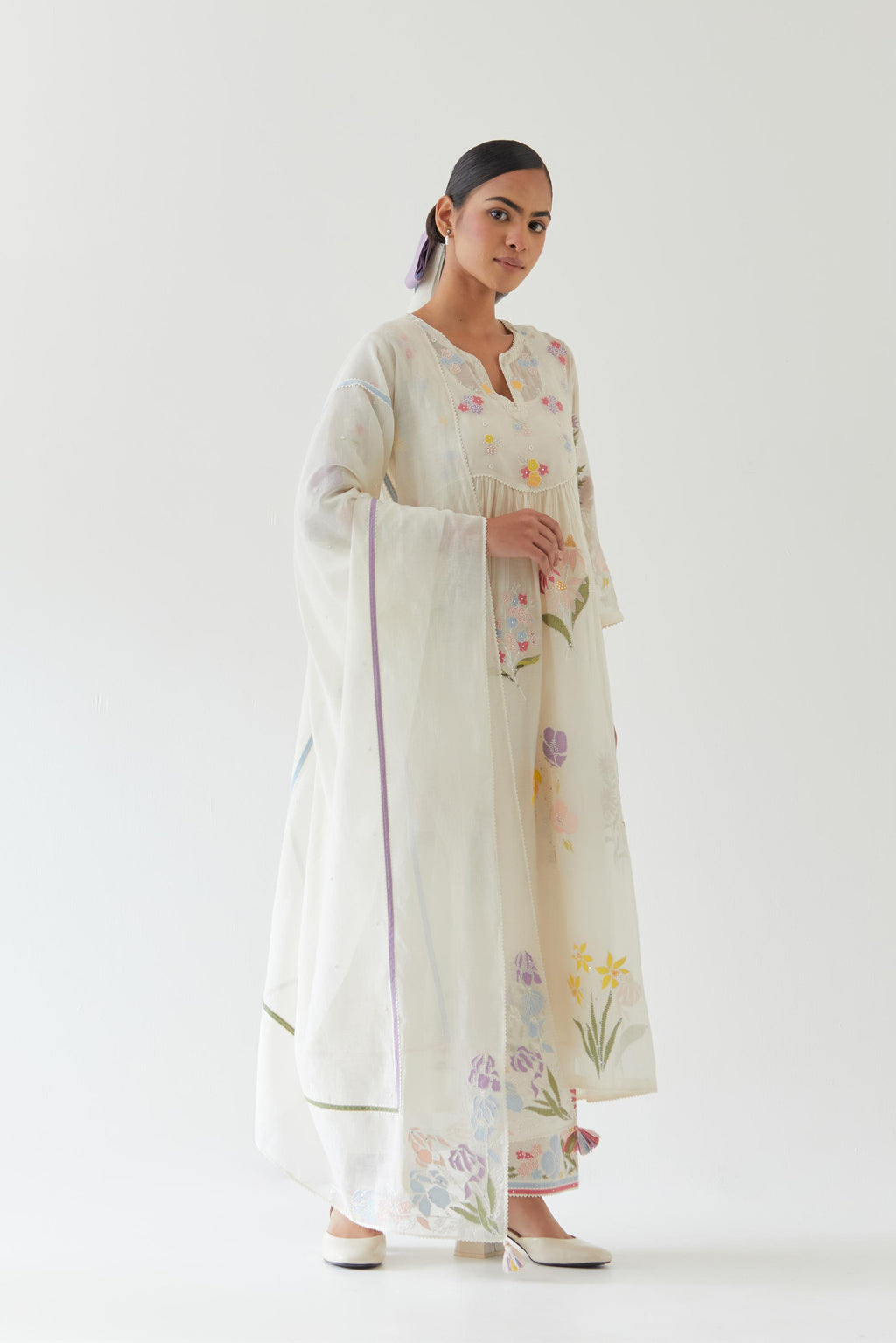 Off white cotton chanderi dupatta with multi colored applique, highlighted with bead & sequins work.