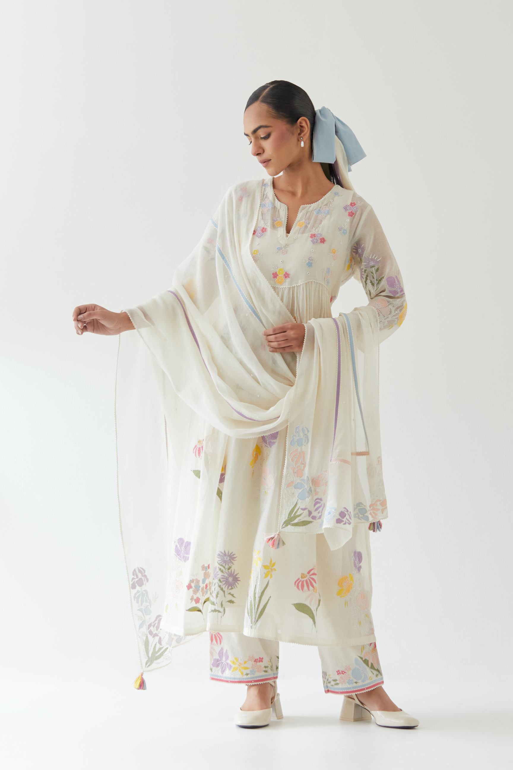 Off white cotton chanderi dupatta with multi colored applique, highlighted with bead & sequins work.