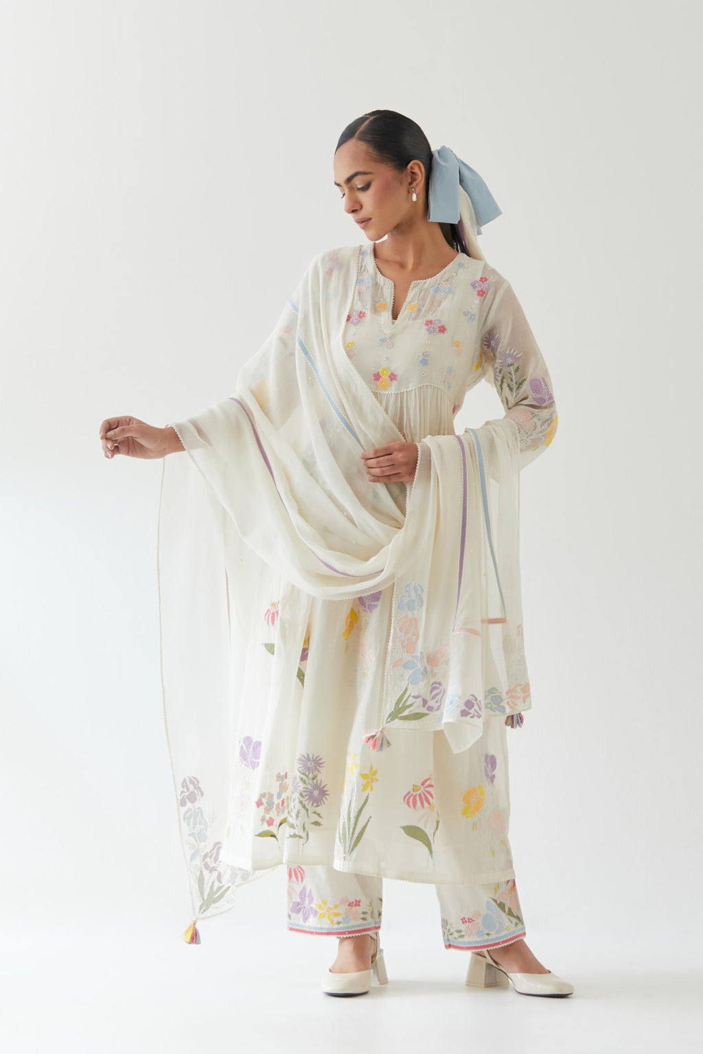 Off white cotton chanderi dupatta with multi colored applique, highlighted with bead & sequins work.