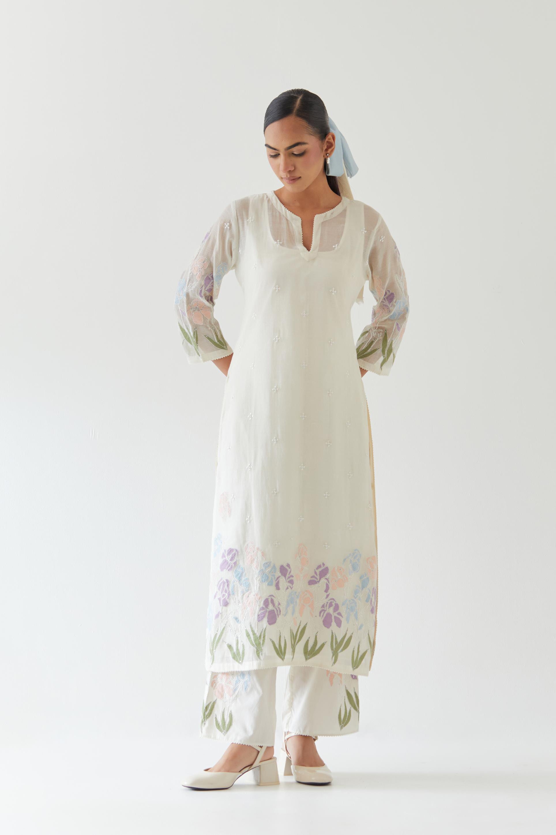 Off white cotton chanderi straight kurta set, decorated with appliqué at the hem and sleeves.