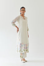 Off white cotton chanderi straight kurta set, decorated with appliqué at the hem and sleeves.