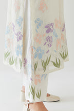 Off white cotton chanderi straight kurta set, decorated with appliqué at the hem and sleeves.