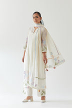 Off white cotton chanderi straight kurta set, decorated with appliqué at the hem and sleeves.