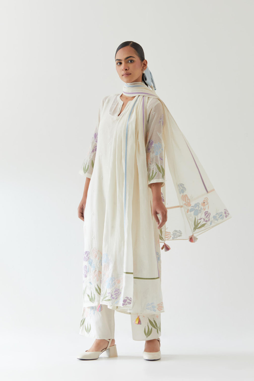 Off white cotton chanderi straight kurta set, decorated with appliqué at the hem and sleeves.
