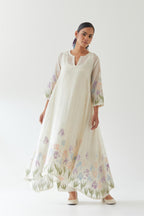 Off white cotton chanderi easy fit, asymmetric hem, paneled kurta set with applique work at hem and sleeves.