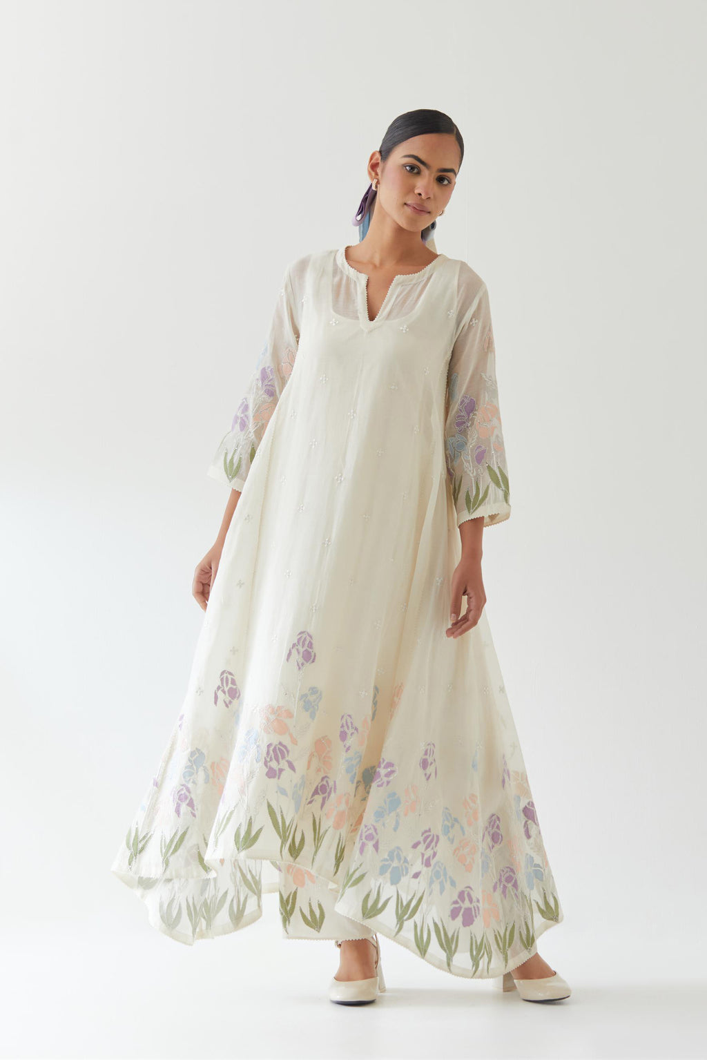Off white cotton chanderi easy fit, asymmetric hem, paneled kurta set with applique work at hem and sleeves.
