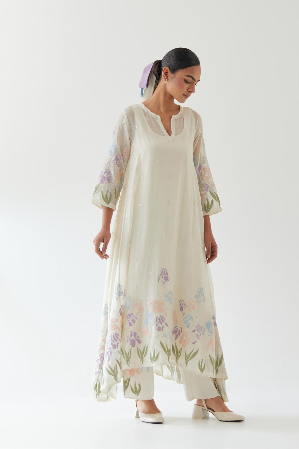 Off white cotton chanderi easy fit, asymmetric hem, paneled kurta set with applique work at hem and sleeves.