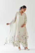 Off white cotton chanderi easy fit, asymmetric hem, paneled kurta set with applique work at hem and sleeves.