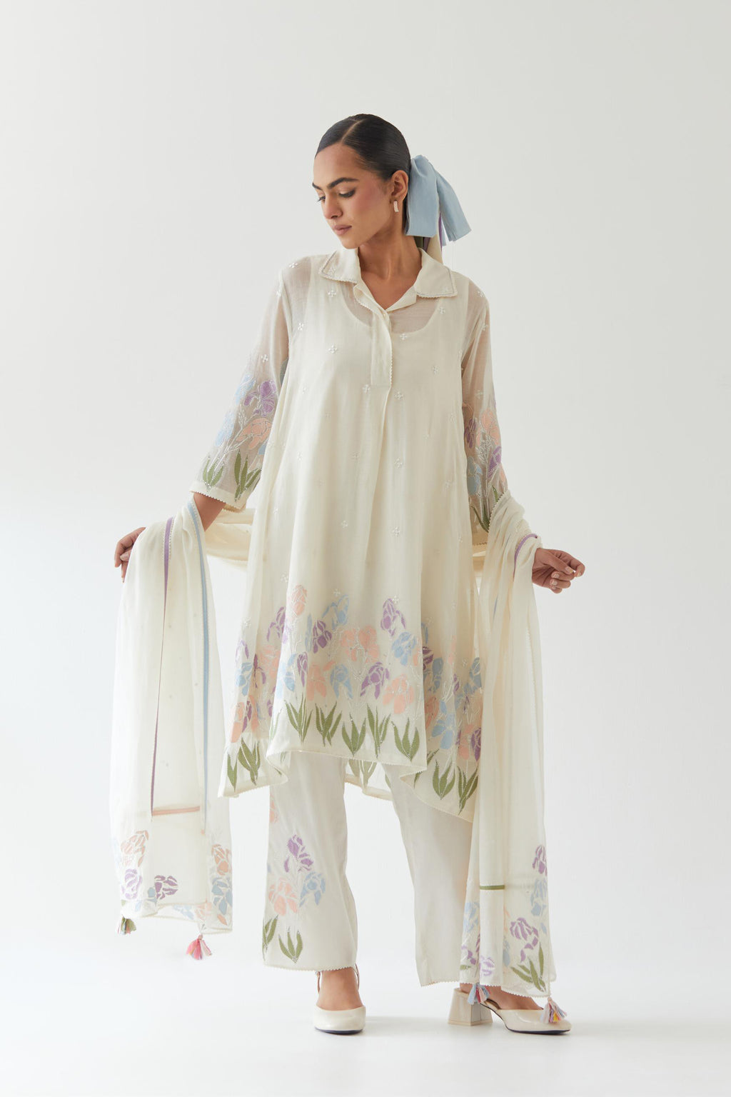 Off white cotton chanderi A-line short kurta set with applique work at hem, highlighted with bead & sequins work.