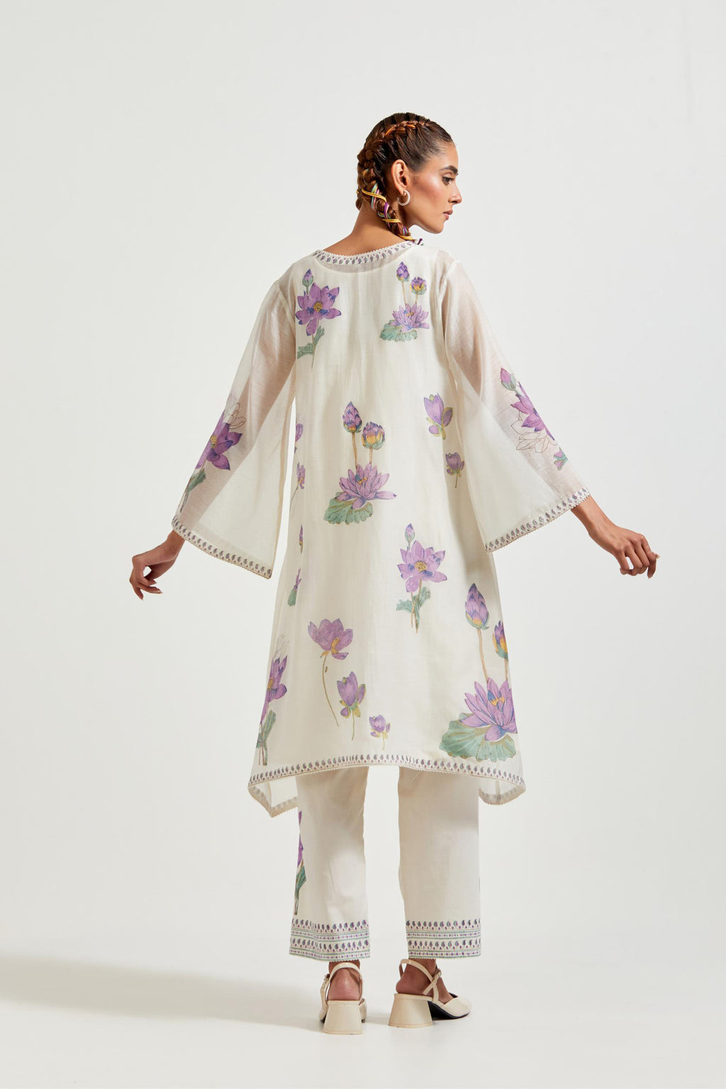 Off white cotton chanderi A-line kurta set features with all-over purple and green lotus flower hand block print.