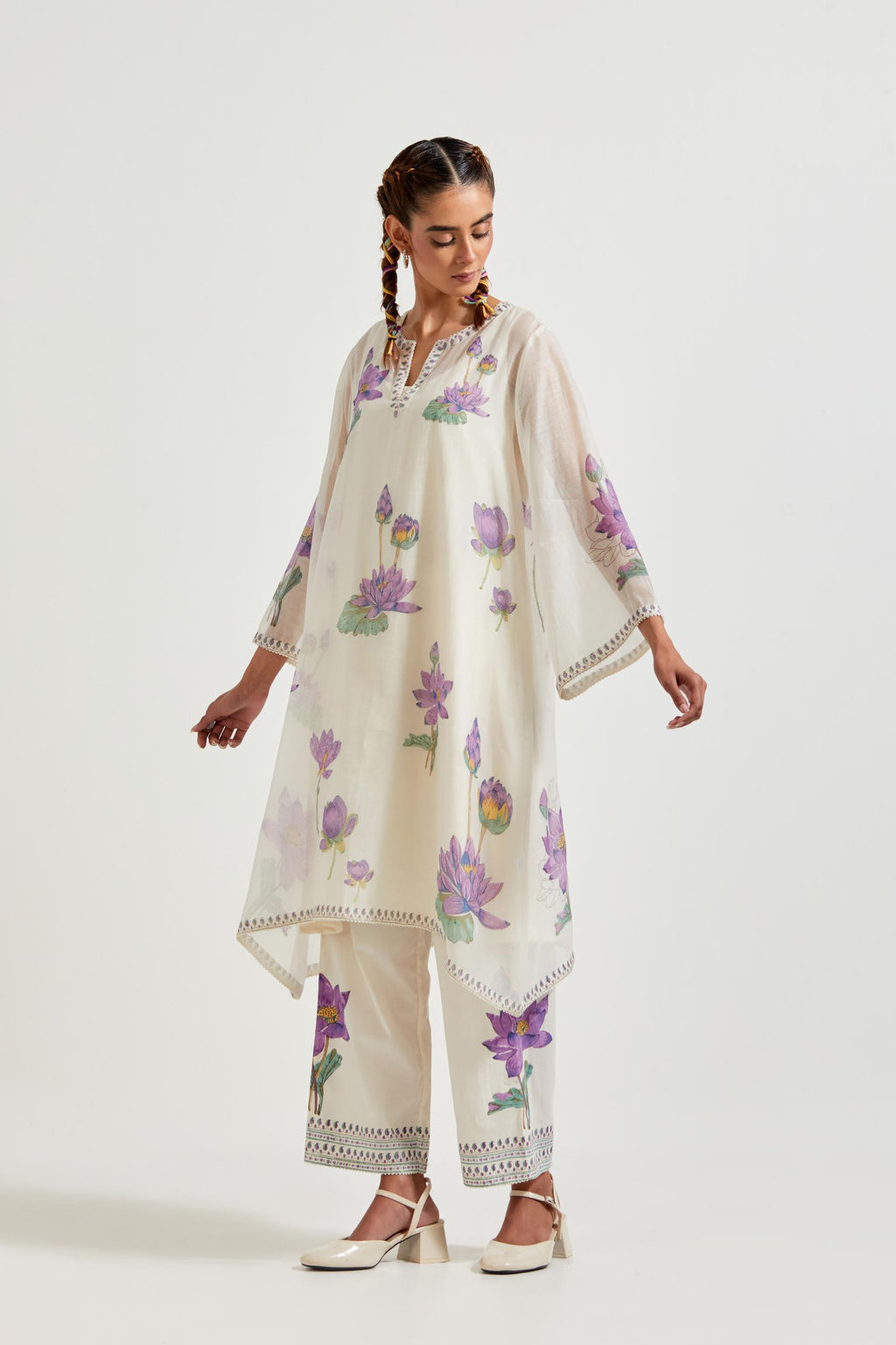 Off white cotton chanderi A-line kurta set features with all-over purple and green lotus flower hand block print.