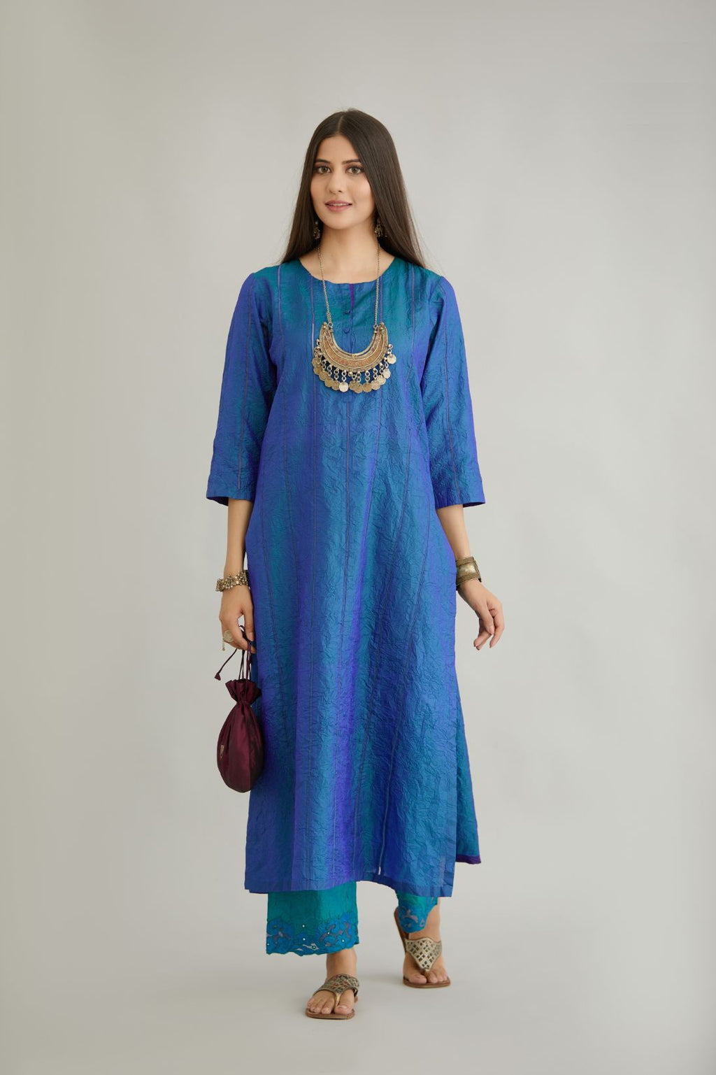 Teal blue hand crushed silk straight kurta with vertical organza fabric inset stripe detail in front, back and 3/4 sleeves, highlighted with contrasting top stitch.