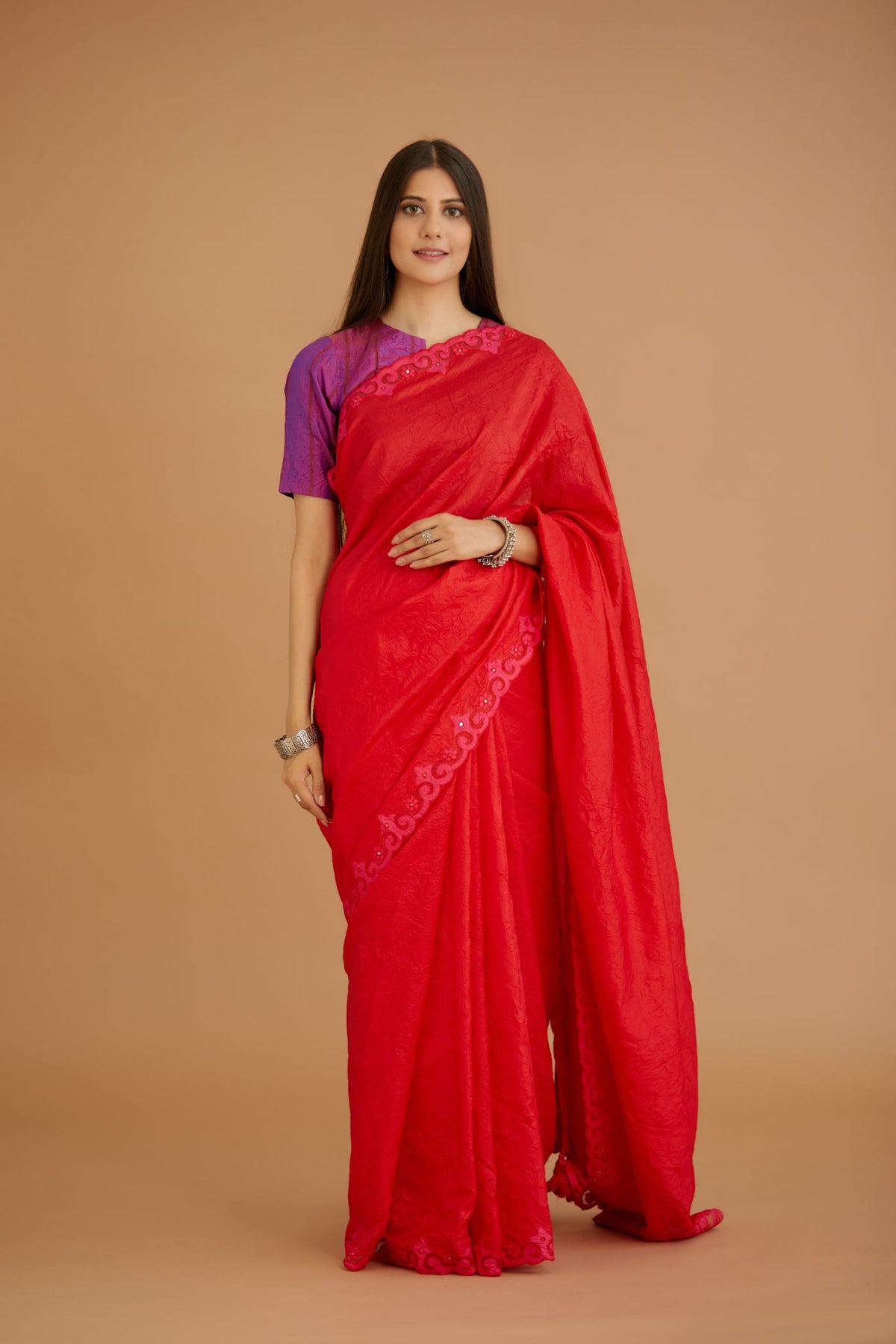 Red hand crushed silk saree set, paired with purple hand crushed silk blouse with vertical inset stripe organza fabric detailing in front, back and sleeves, highlighted with contrasting top stitch.