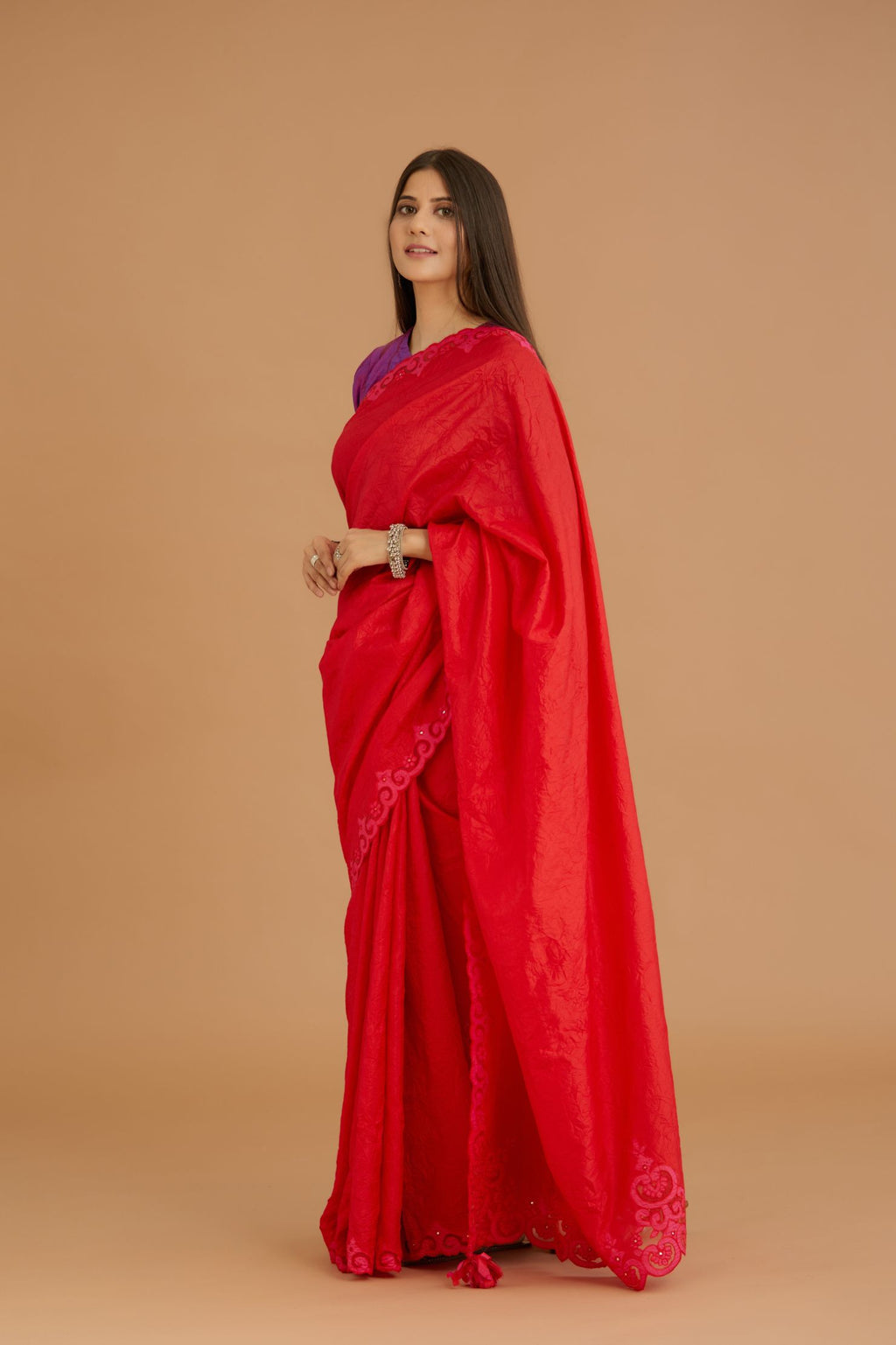 Red hand crushed silk saree set, paired with purple hand crushed silk blouse with vertical inset stripe organza fabric detailing in front, back and sleeves, highlighted with contrasting top stitch.