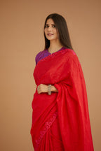 Red hand crushed silk saree set, paired with purple hand crushed silk blouse with vertical inset stripe organza fabric detailing in front, back and sleeves, highlighted with contrasting top stitch.