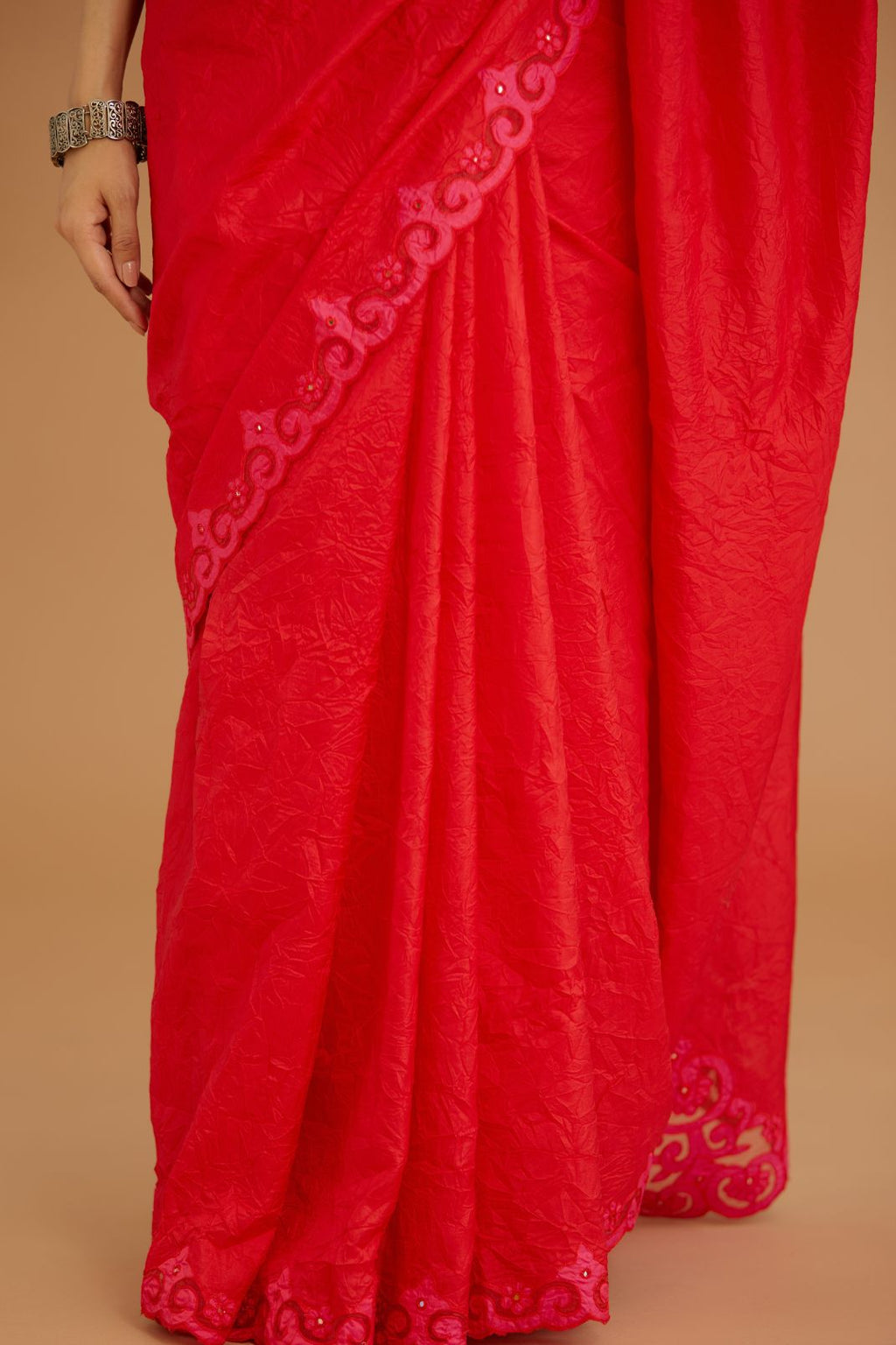 Red hand crushed silk saree set, paired with purple hand crushed silk blouse with vertical inset stripe organza fabric detailing in front, back and sleeves, highlighted with contrasting top stitch.