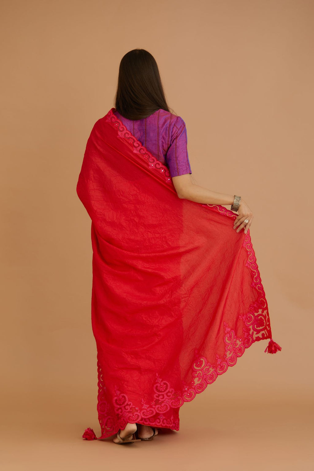 Red hand crushed silk saree set, paired with purple hand crushed silk blouse with vertical inset stripe organza fabric detailing in front, back and sleeves, highlighted with contrasting top stitch.
