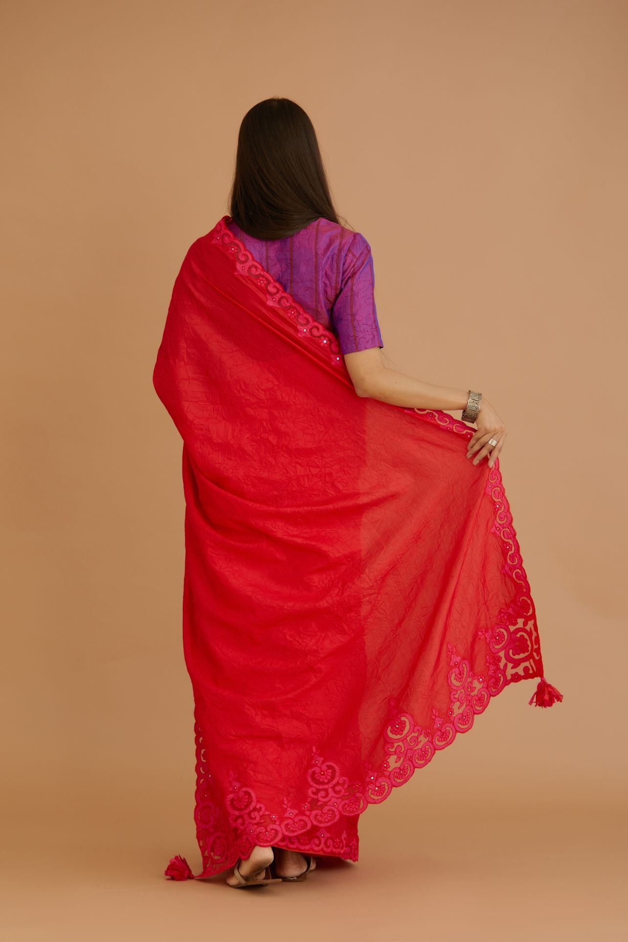 Red hand crushed silk saree set, paired with purple hand crushed silk blouse with vertical inset stripe organza fabric detailing in front, back and sleeves, highlighted with contrasting top stitch.