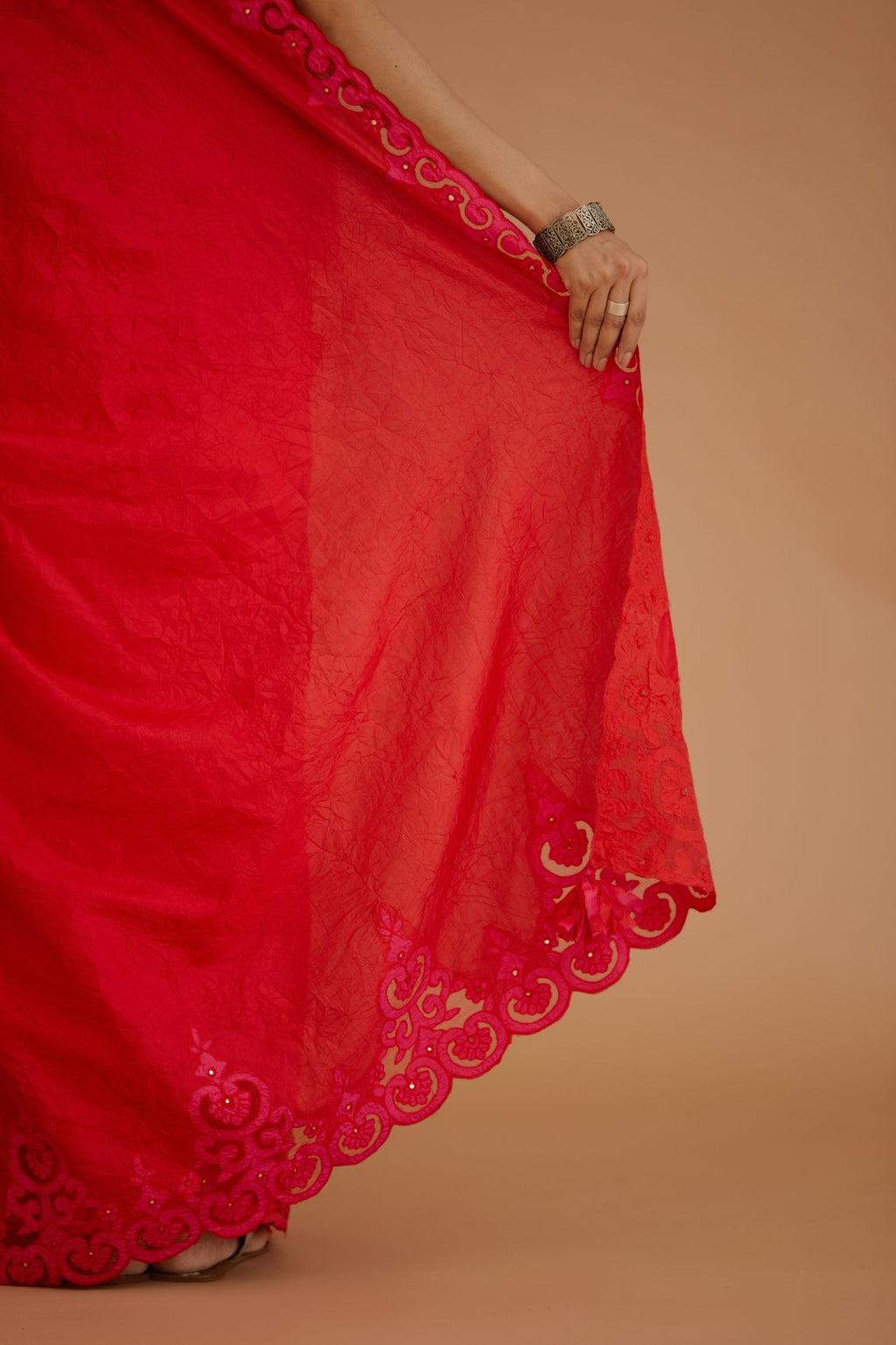 Red hand crushed silk saree set, paired with purple hand crushed silk blouse with vertical inset stripe organza fabric detailing in front, back and sleeves, highlighted with contrasting top stitch.